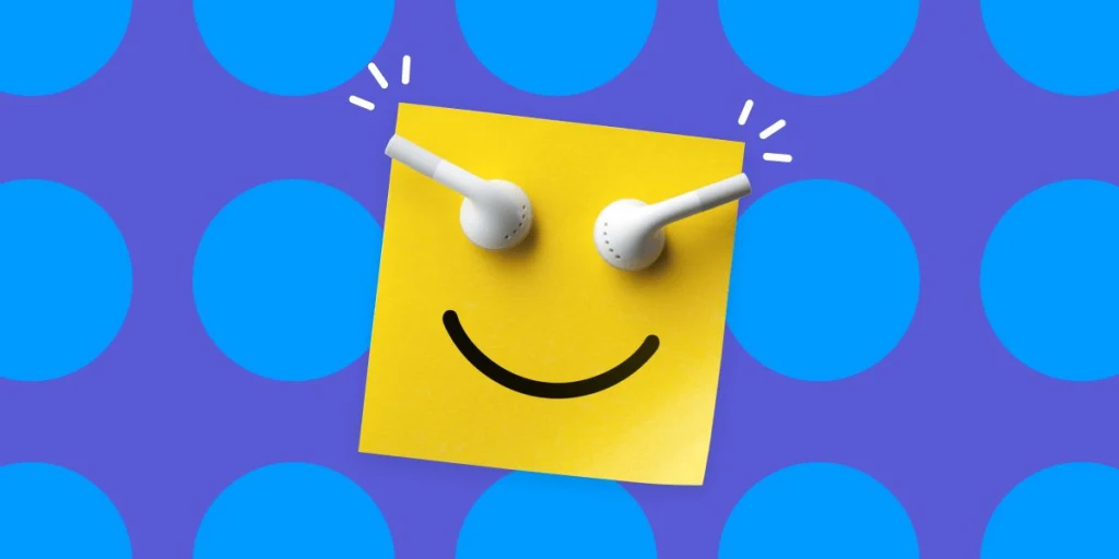 Airpods posés sur un post-it avec un sourire