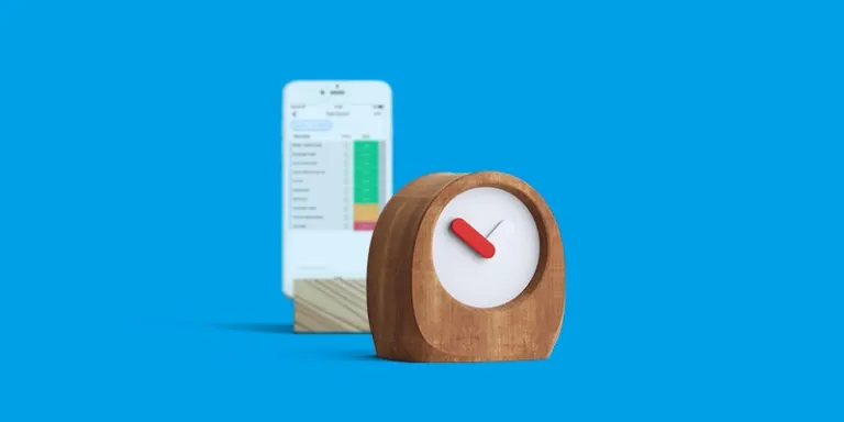 blue background with a phone showing a monday.com board, and a wooden clock