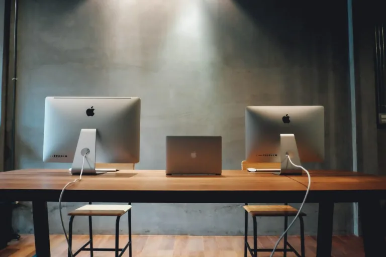 two computers on desk