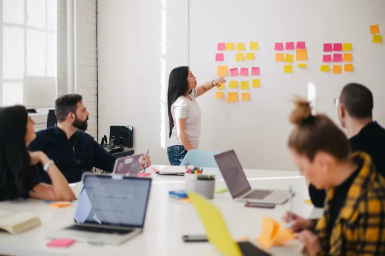 Project manager walking a team through a project plan