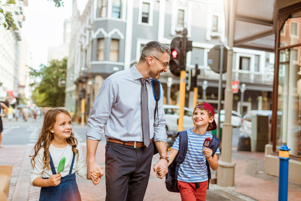 Father walking children to school