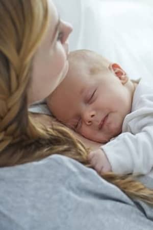 mother holding her baby in her arms