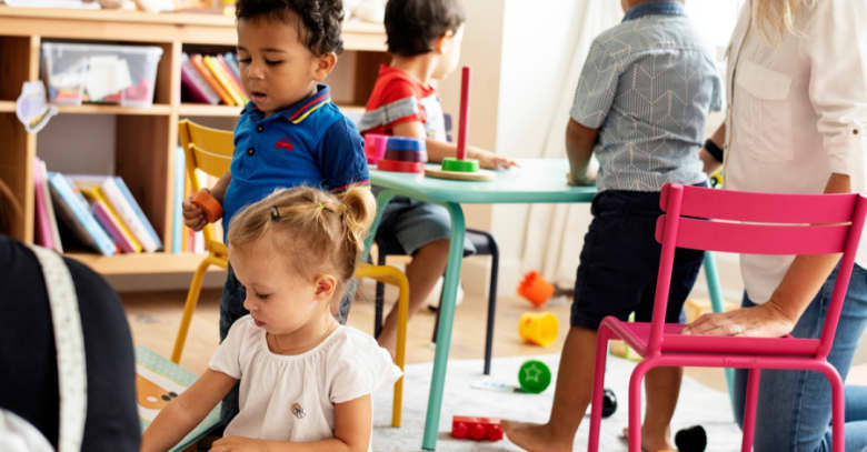 A small group of children engage in learning at a preschool