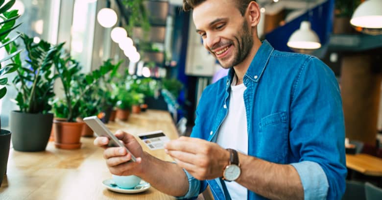 A man uses a credit card