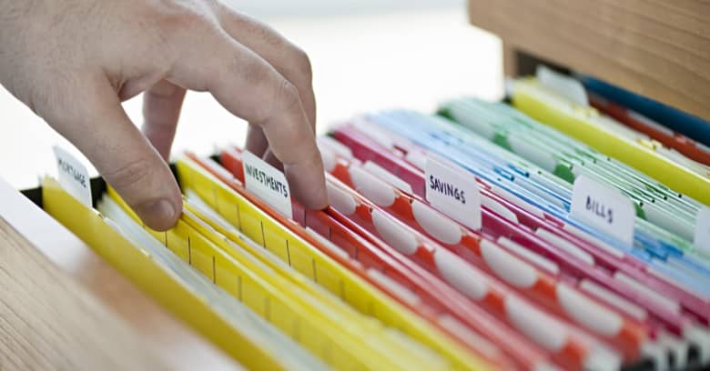 A person looks through their personal documents.