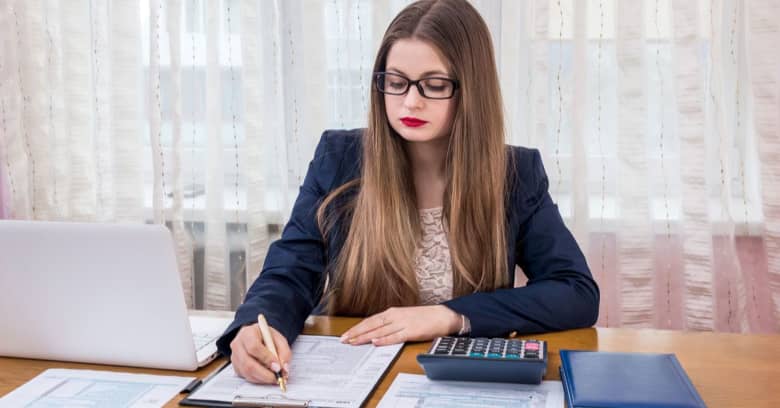 An accountant looks over tax paperwork.