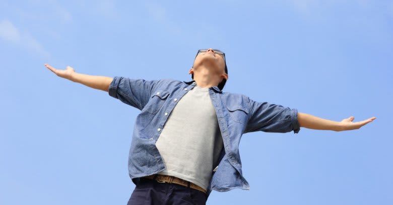 An unworried man stares at the sky.