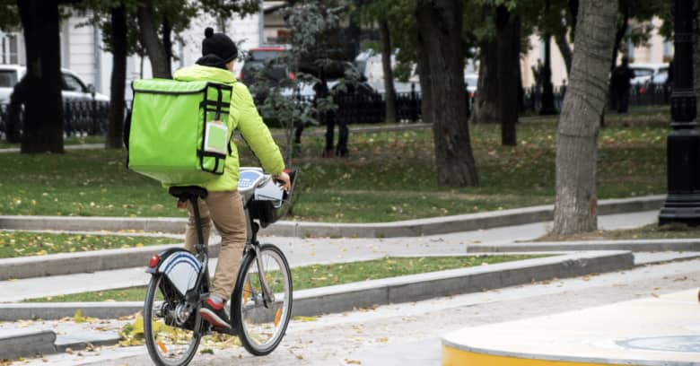 a person delivers food on a bike