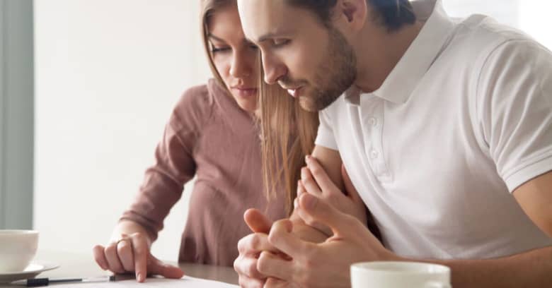 a young couple are researching their new state and neighborhood