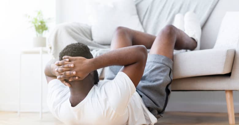 A man exercises at home