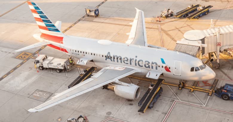 A commercial airplane is parked at the terminal