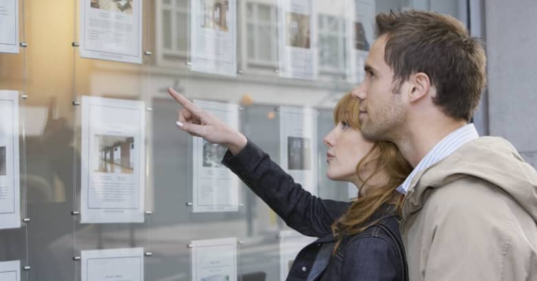 A couple in their 30s looking at homes