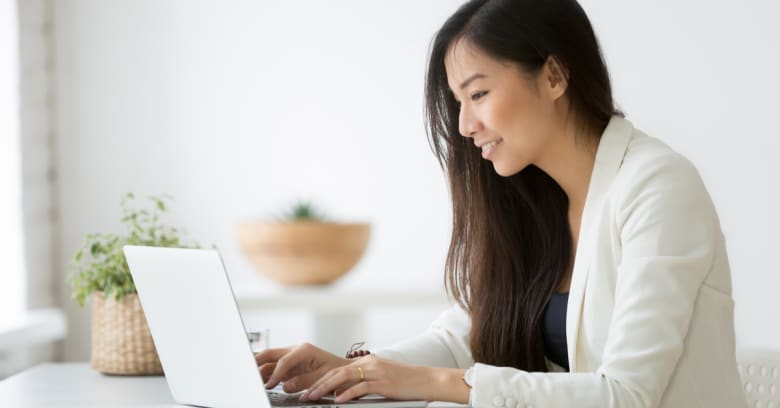 a woman checks in with her business contacts while she stays at home and works