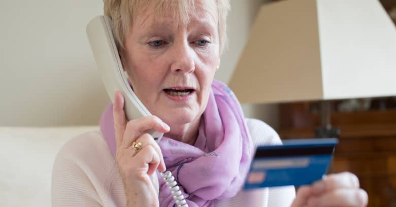 an older woman tries to make a charitable donation by phone
