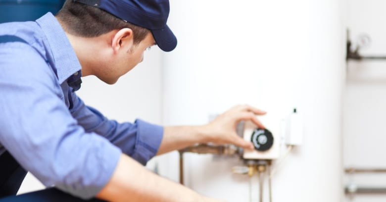 Man repairing hot water heater