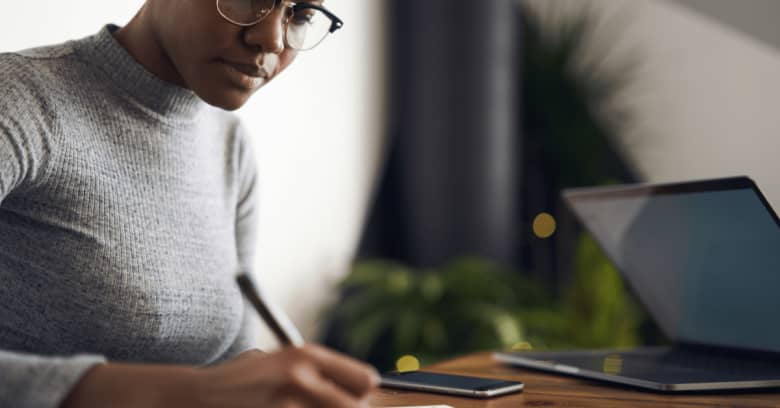 a small business owner signs insurance papers