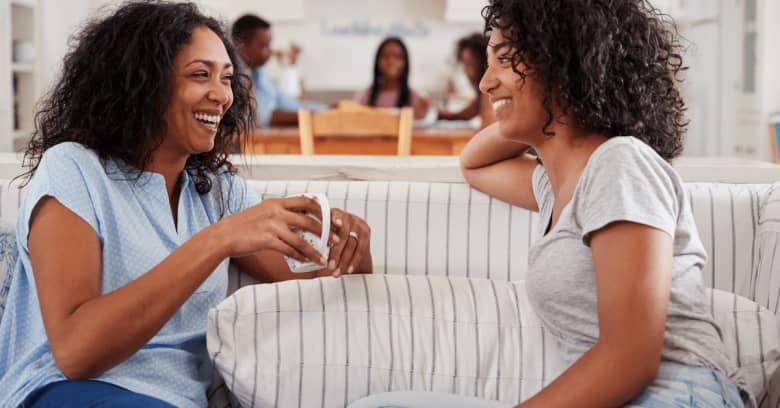 freshman and mother talking while sitting