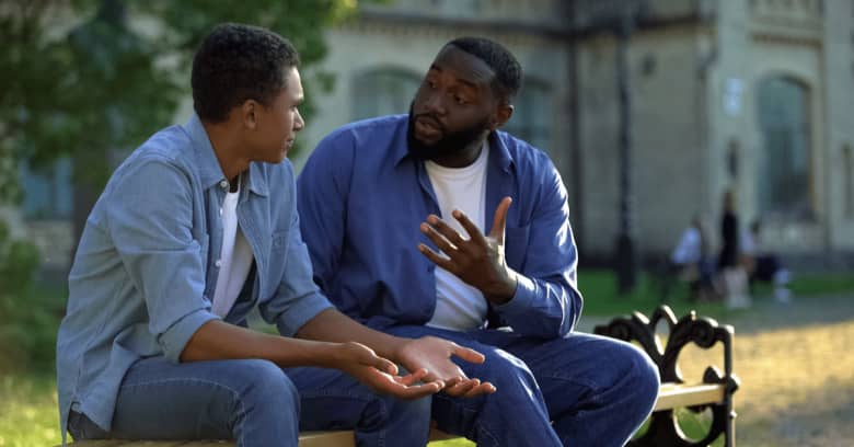 father talking to son