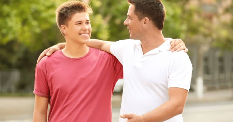 father smiling with son