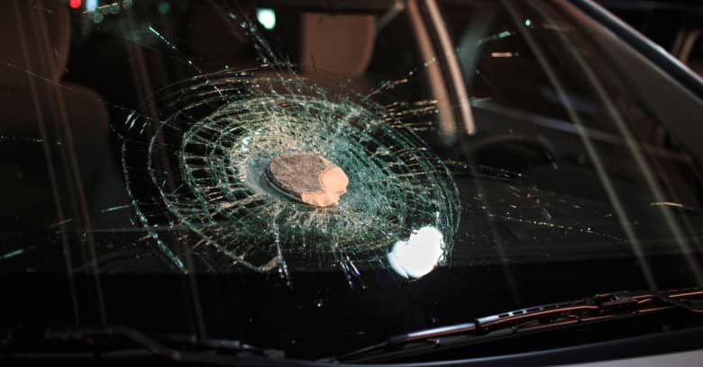 car window being hit by a rock