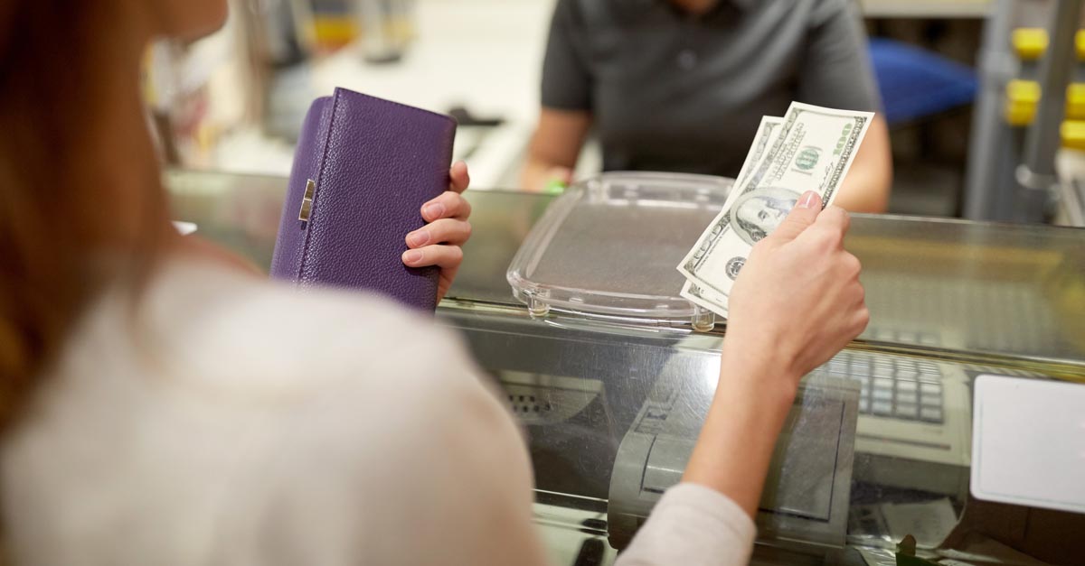 Woman saving change from a transaction