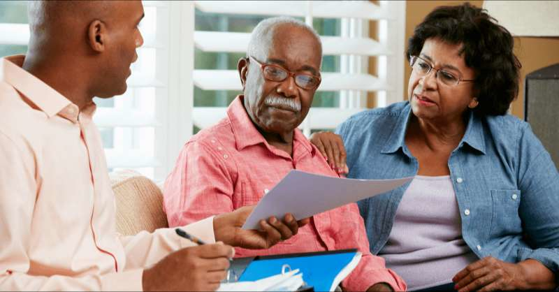 A son helps his senior parents sort through their medical debt.