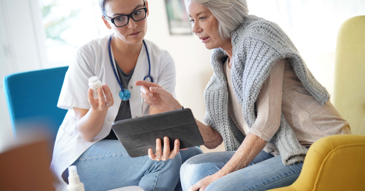 A woman discusses her medication and test results with her doctor