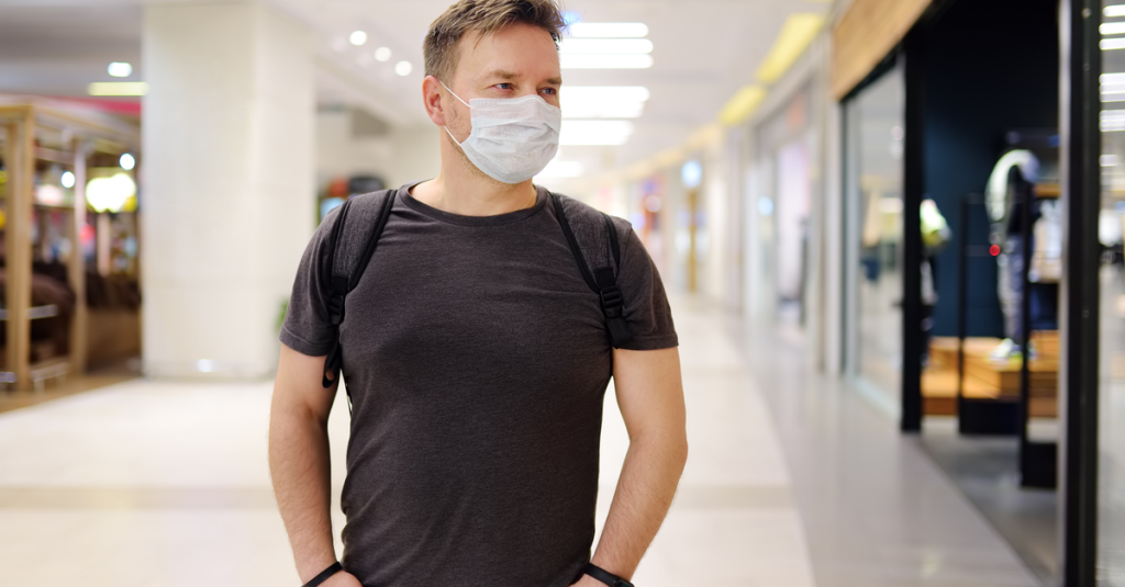 a man in a mask ventures out in public after the coronavirus quarantine