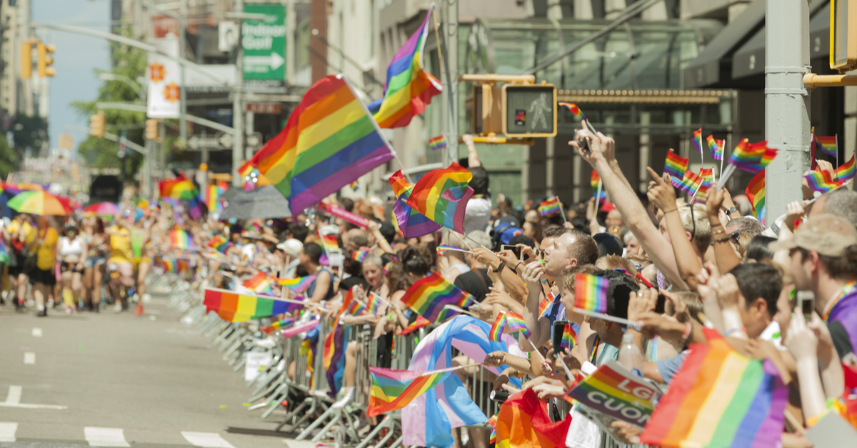 A group of onlookers during a pride parade