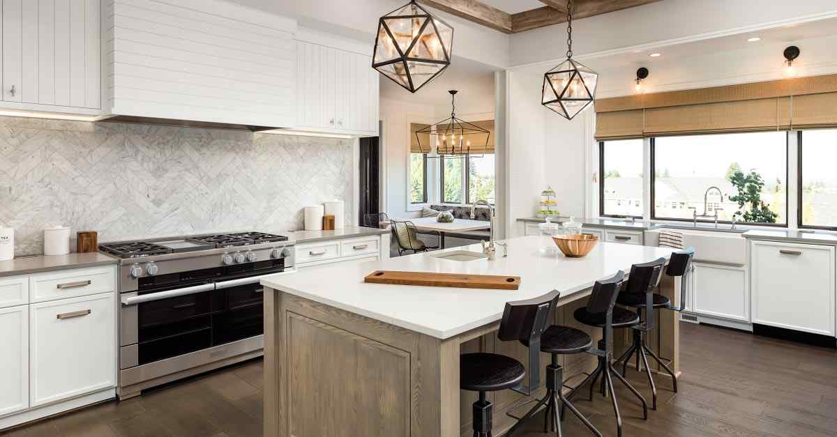 A kitchen containing modern appliances and fixtures.