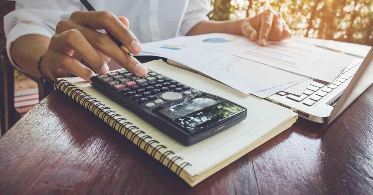 A woman calculates her personal finances.