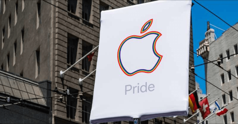 The Apple logo with the word 'Pride' is shown on an outdoor sign