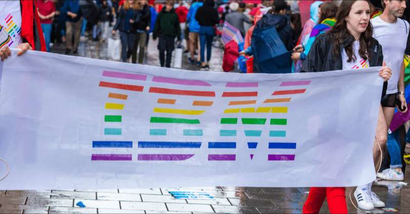 An IBM banner is shown at a Pride Month parade