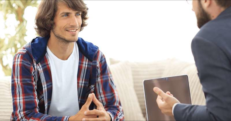 A man talks with a credit counselor