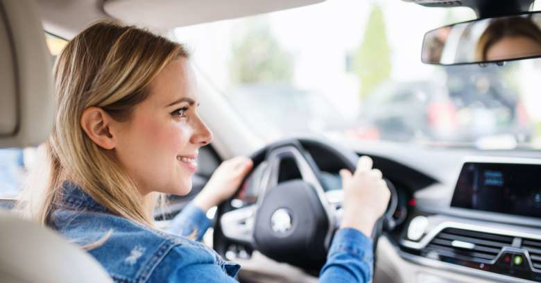 A woman drives her car