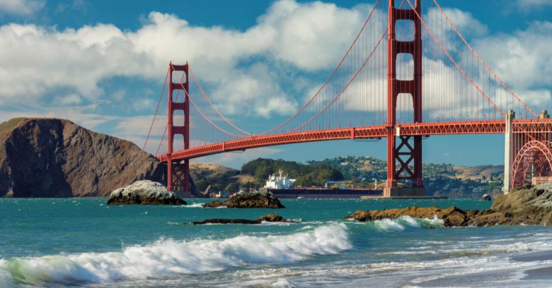 A view of the Golden Gate Bridge in California at sunset.