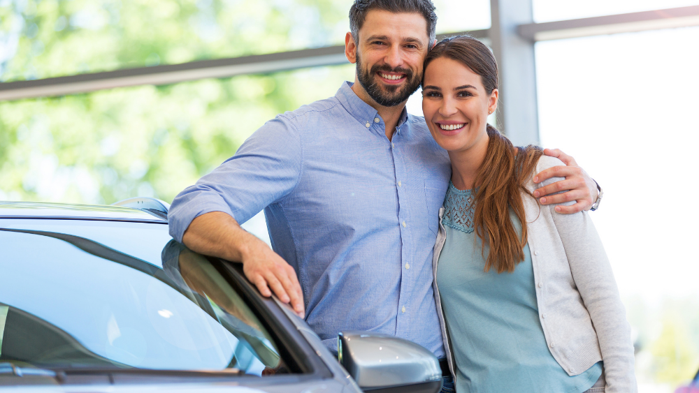 Couple purchasing a new car.