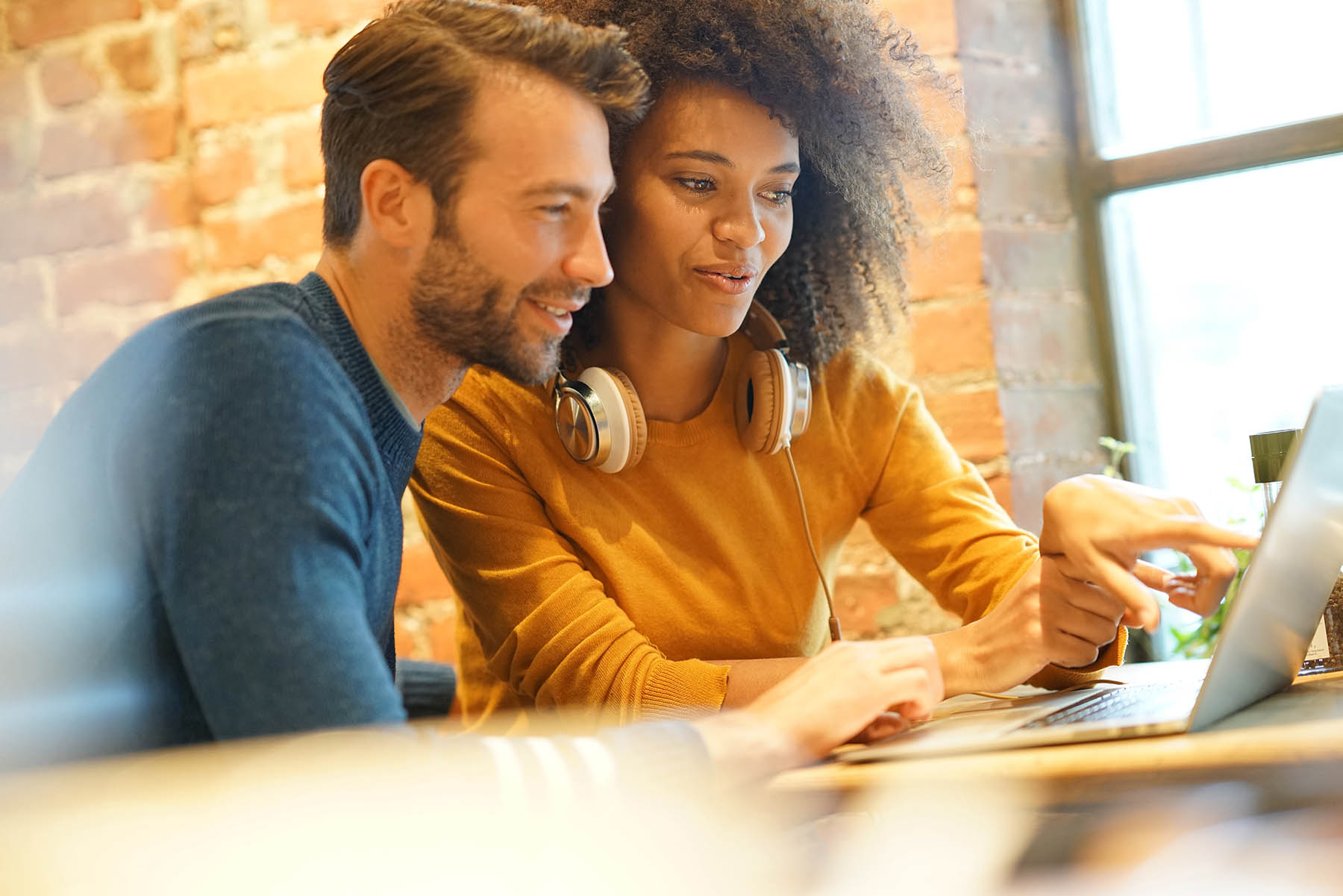 Man and woman looking at computer