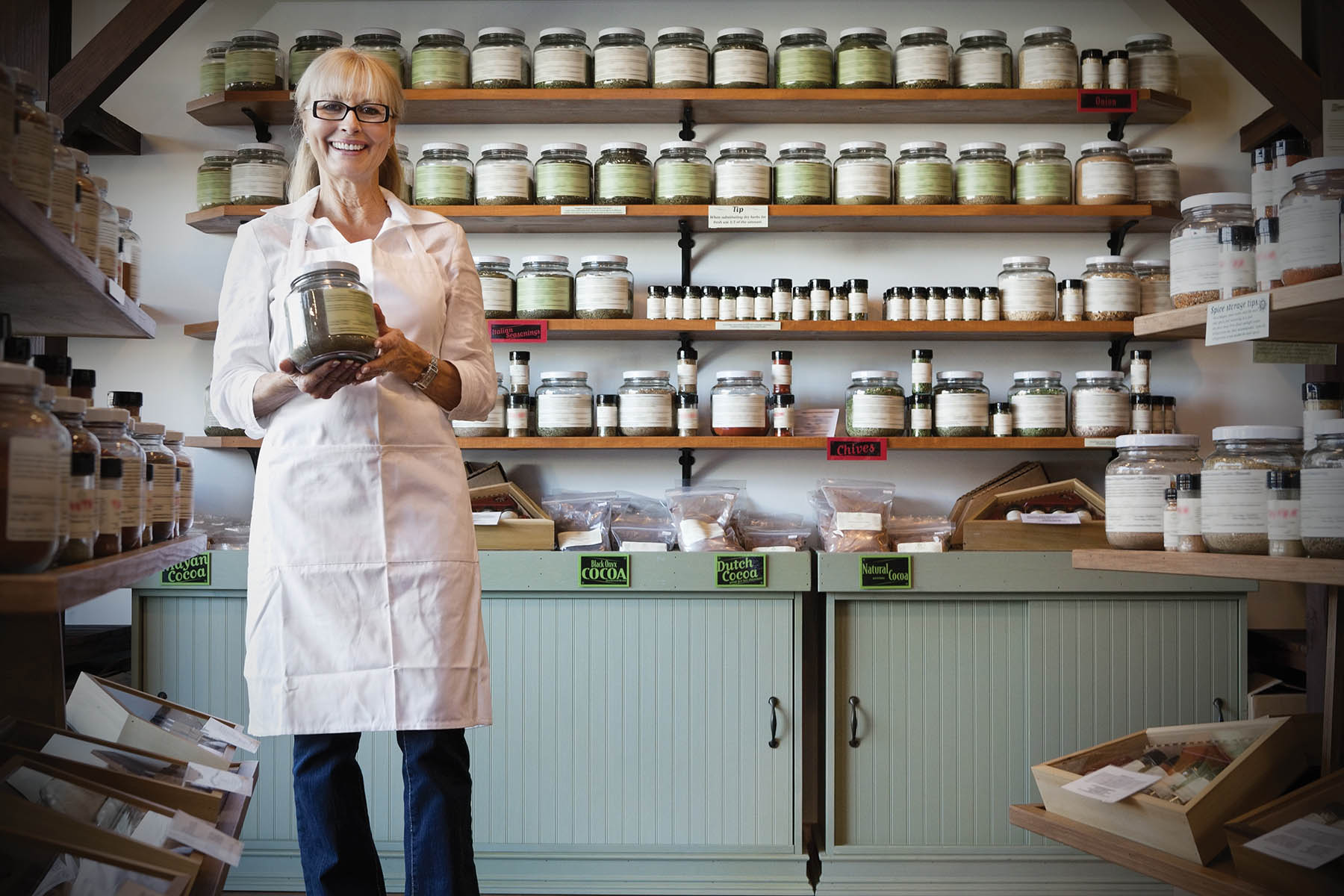 Business woman in shop with spices
