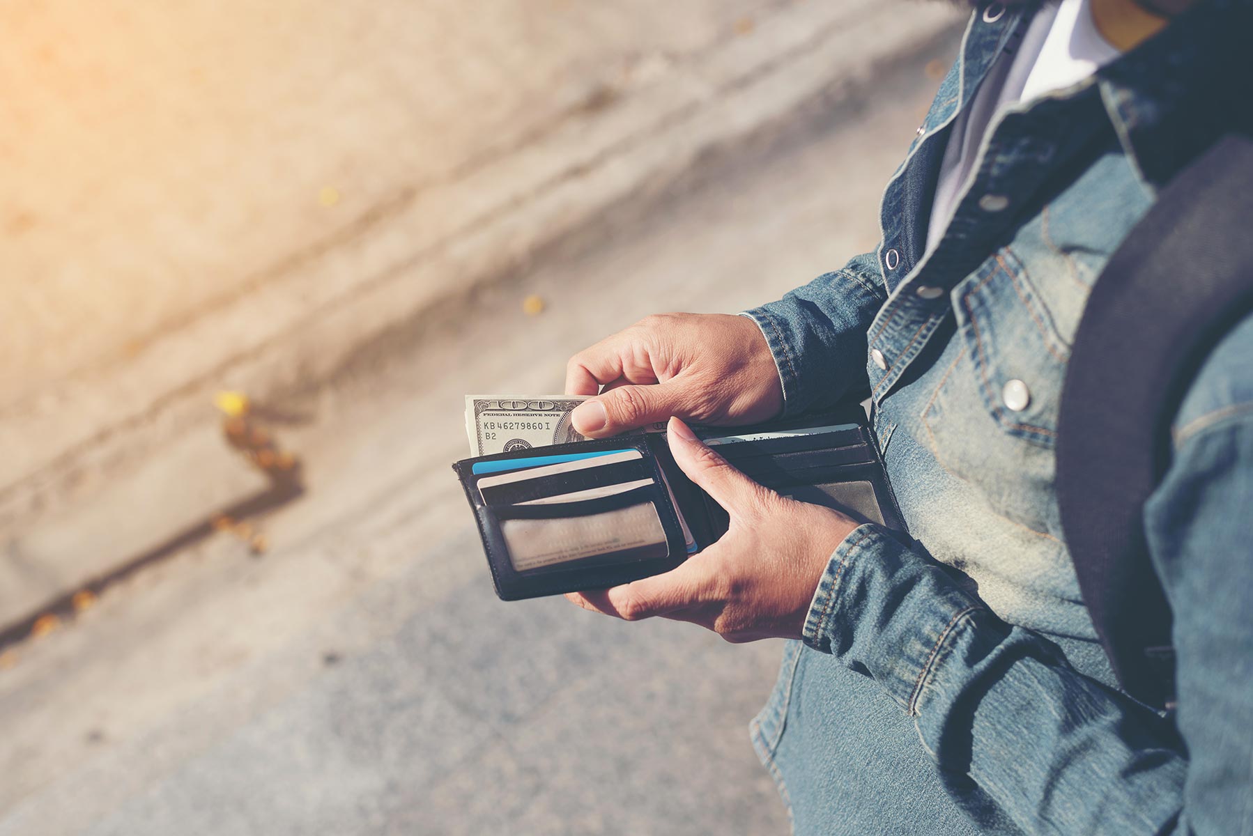man with money in his wallet