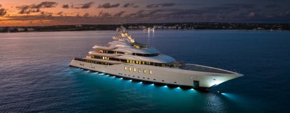 Yacht Out on the Water At Night With Lights