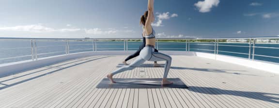 Woman Doing Yoga on the Deck of a Yacht