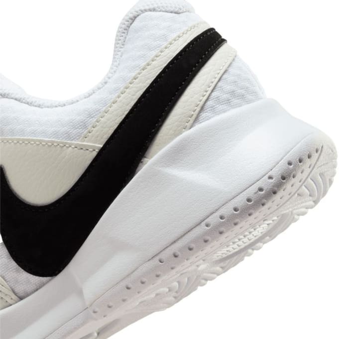 white nike shoes with black laces