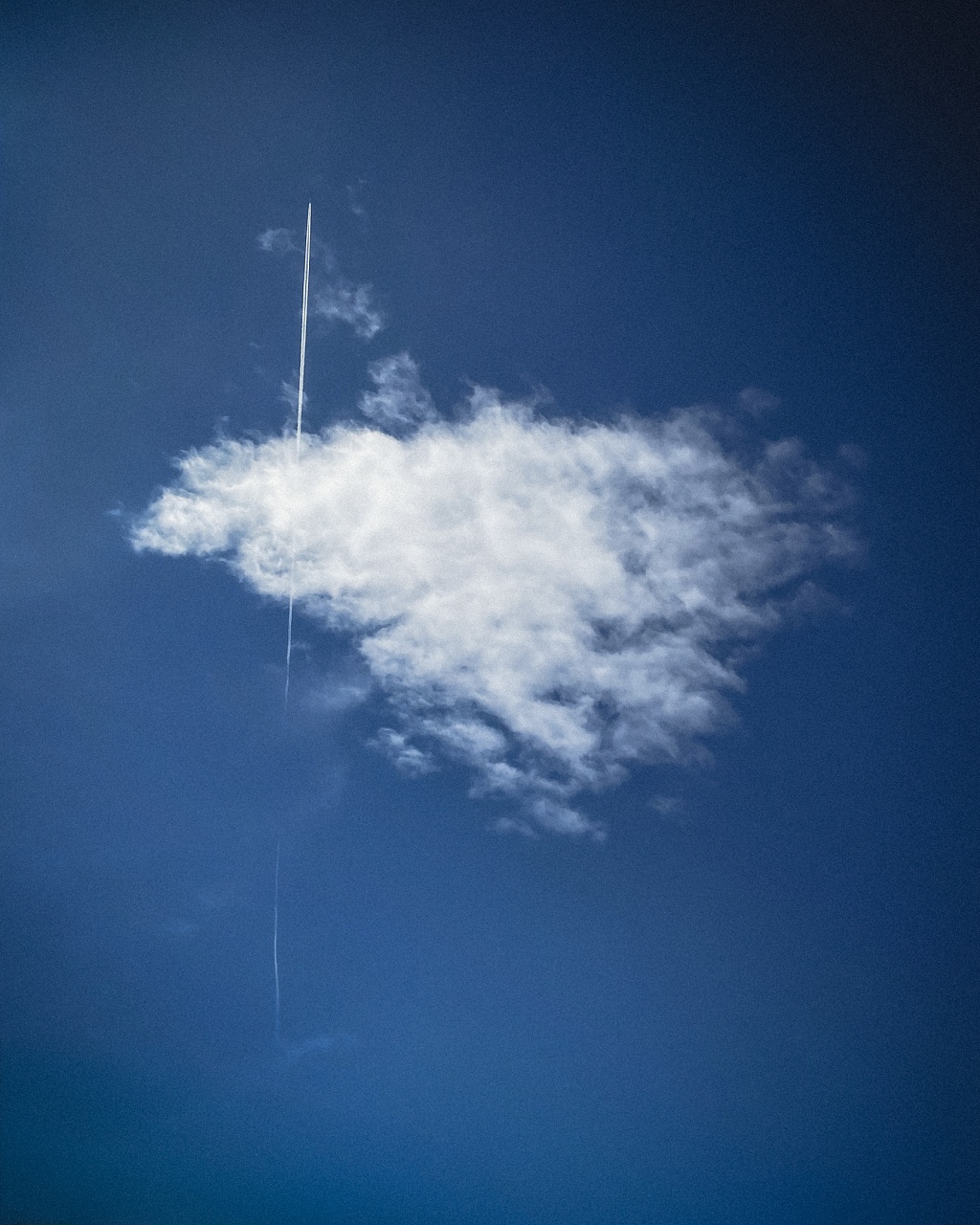 Airplane piercing a cloud (Valencia, Spain)