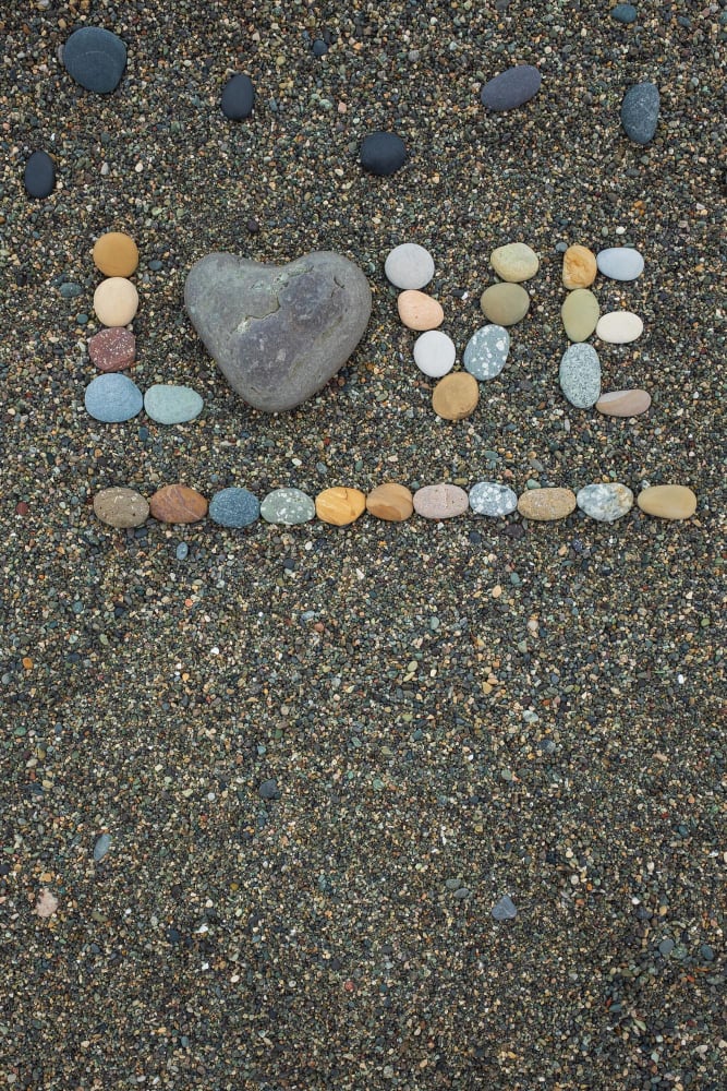 word love made from stones sandy beach