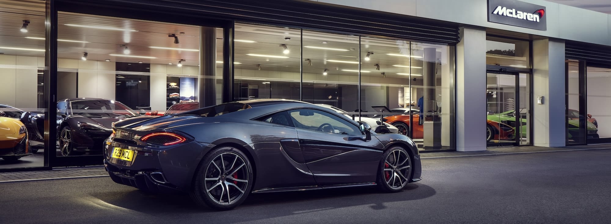 A McLaren retailer showroom at dusk