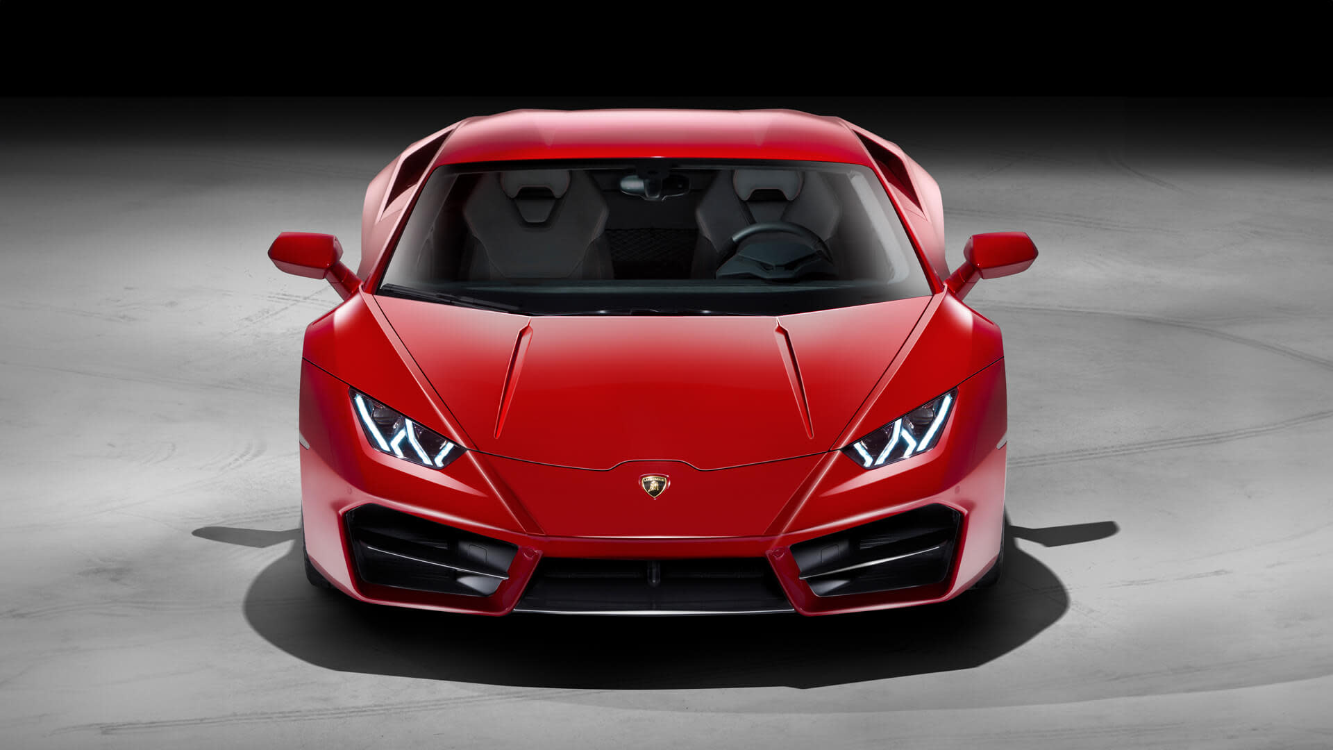 Lamborghini Huracán RWD in motion on a racetrack, with focus on rear diffuser and dynamic lines