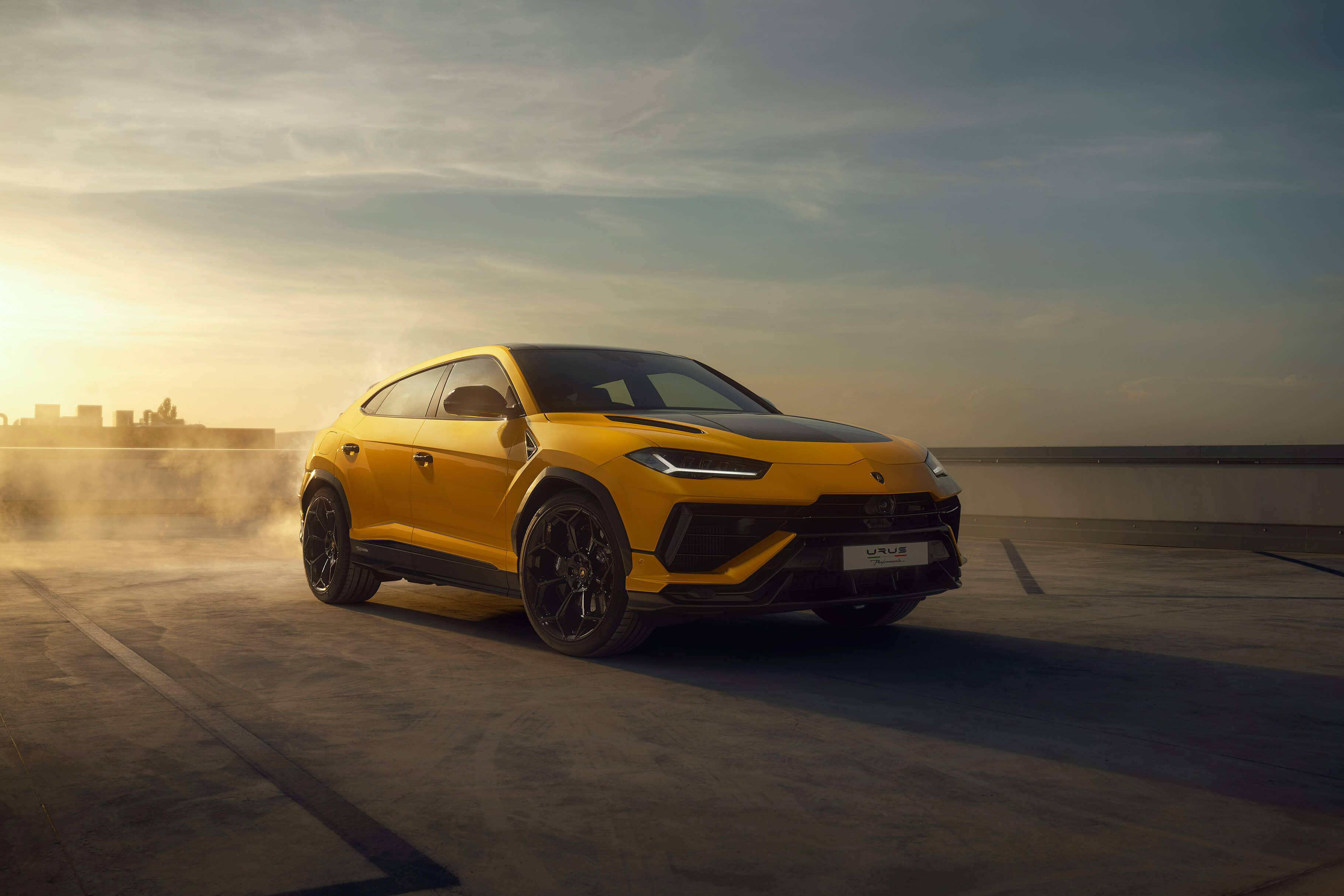 Lamborghini Urus Performante driving on a winding mountain road at high speed