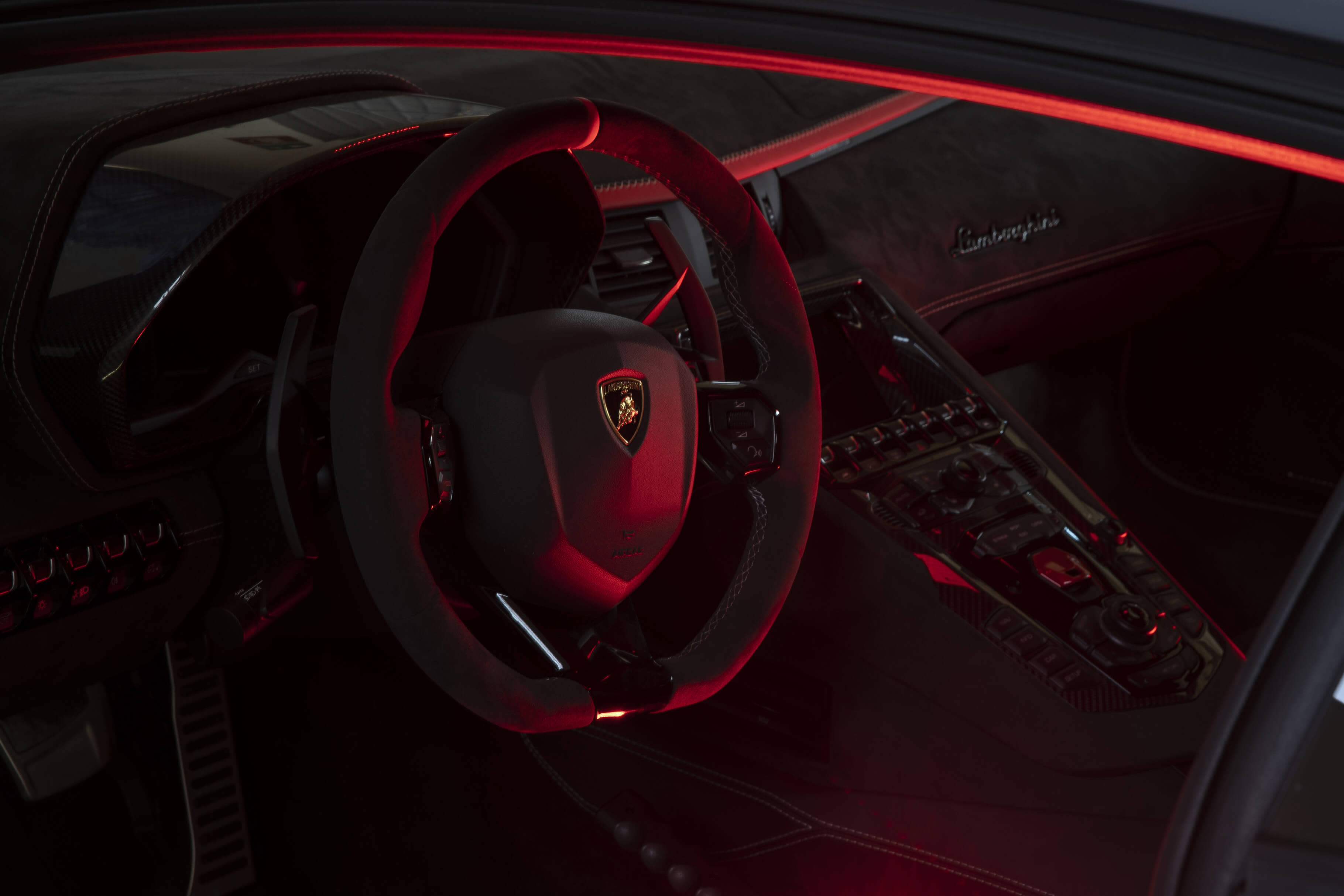 Angled side view of a Lamborghini Aventador LP 780-4 Ultimae filmed on track, captured from a dynamic driving video