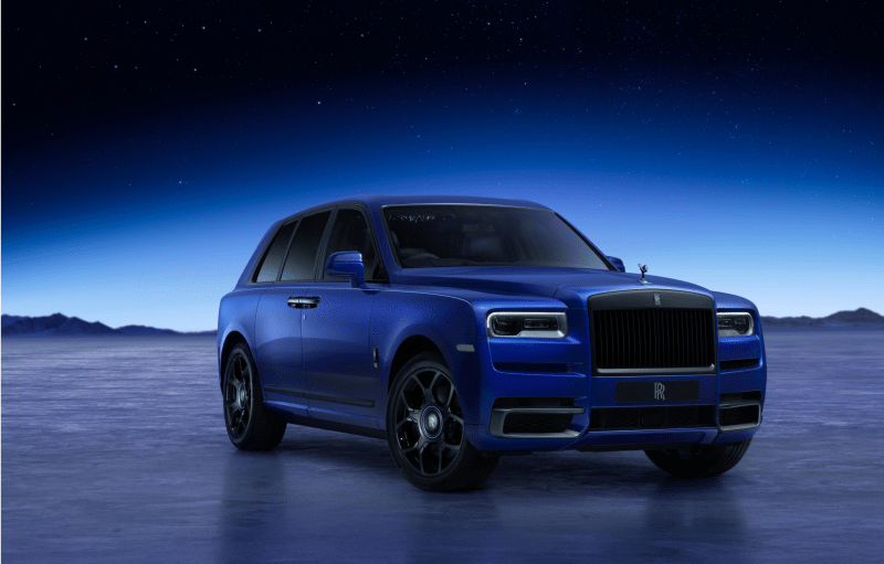 Rolls-Royce Black Badge Cullinan Blue Shadow in Stardust Blue exterior paint, showcasing its luxury SUV design.